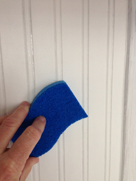 Wiping Faux Wainscoting with damp sponge