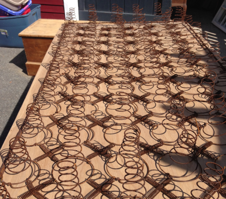 Rusty Bedsprings on Plywood Base